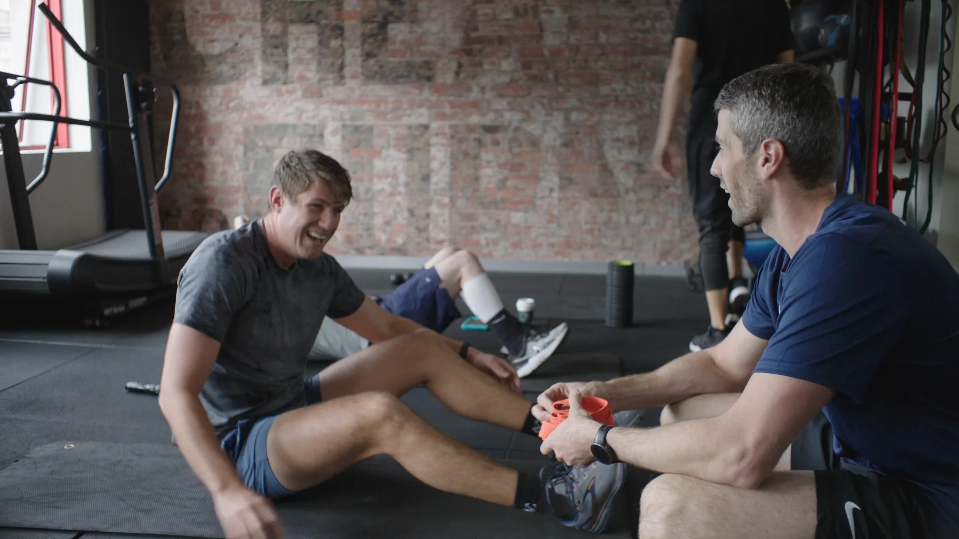 Dylan Jones, founder of State of Fitness, sharing a laugh with a member mid-session at the South Yarra studio